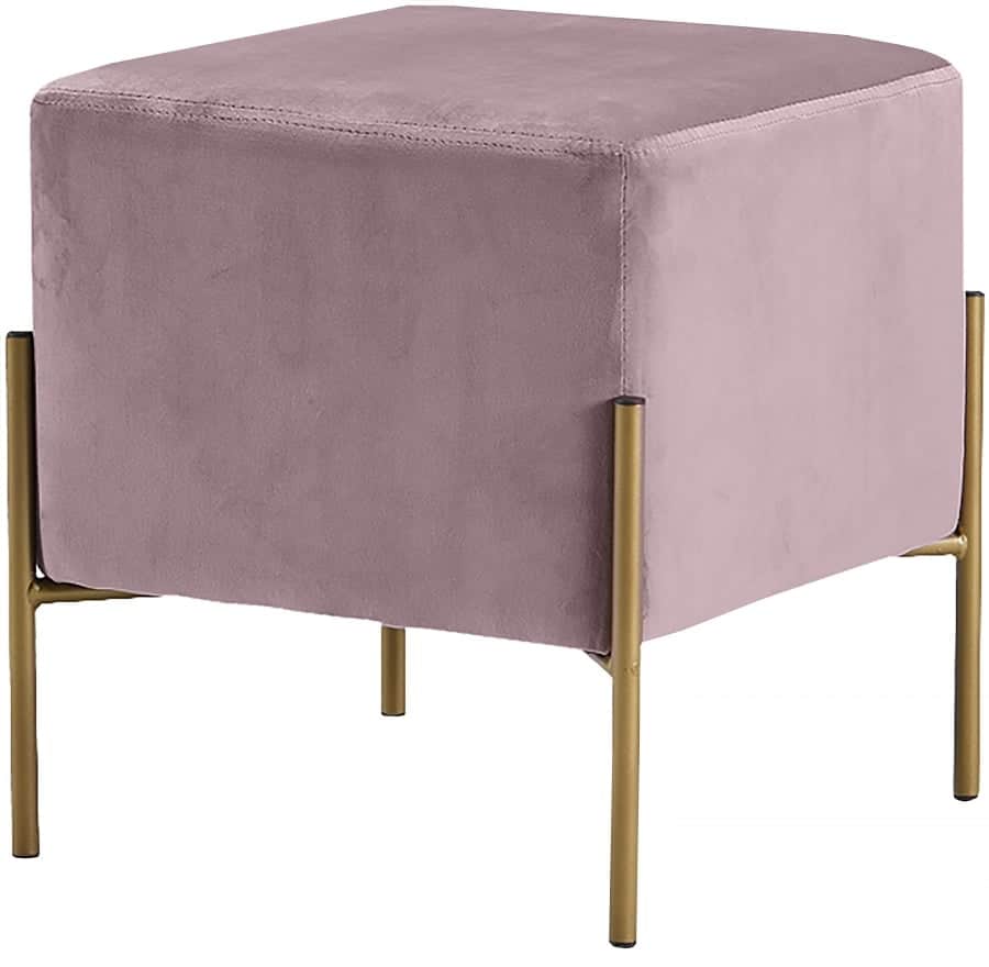 A modern pink velvet ottoman with gold metal legs, available for rental.